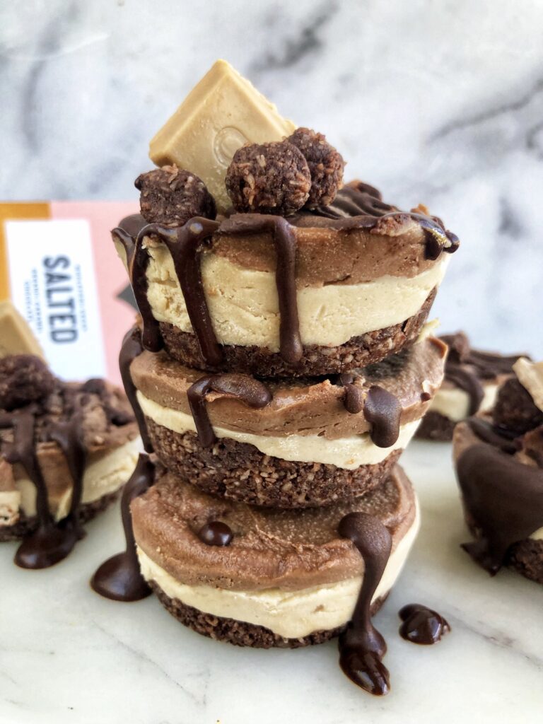 A stack of layered caramel brownie cheesecakes