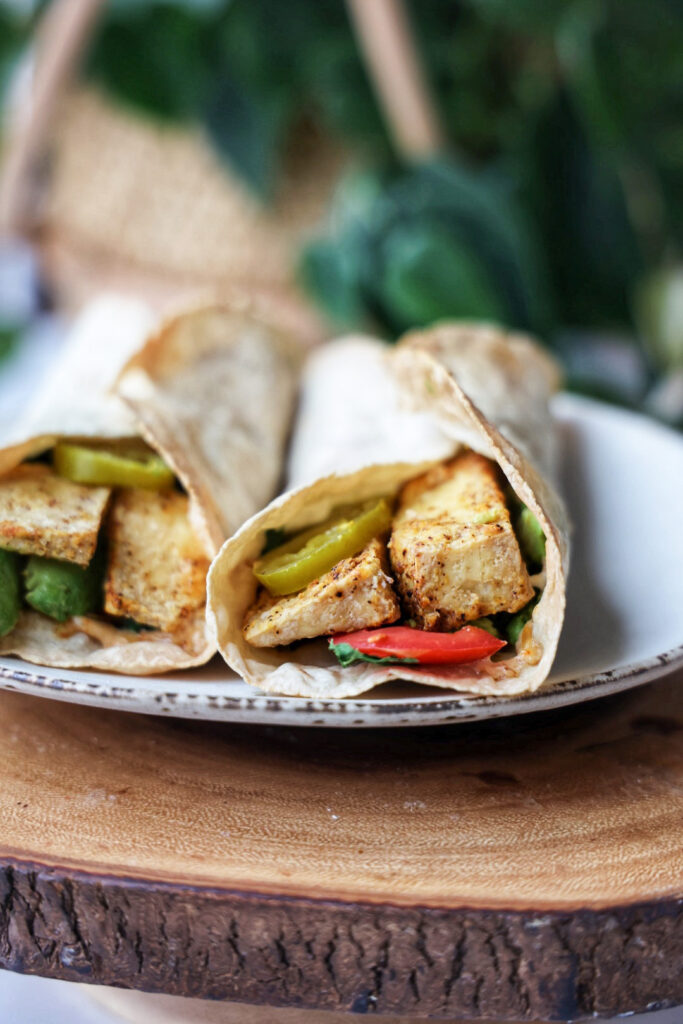 A plate of grilled tofu California wraps.