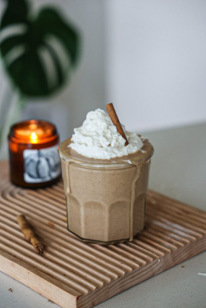 An eggnog shake topped with whipped cream.