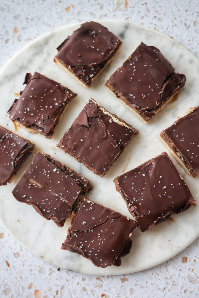 A plate of vegan millionaire's shortbread bars.