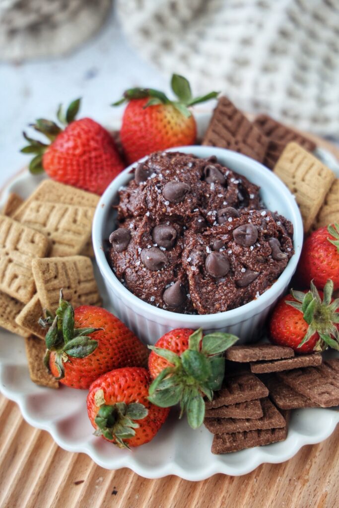 Healthy brownie batter dip with fruit and cookies.
