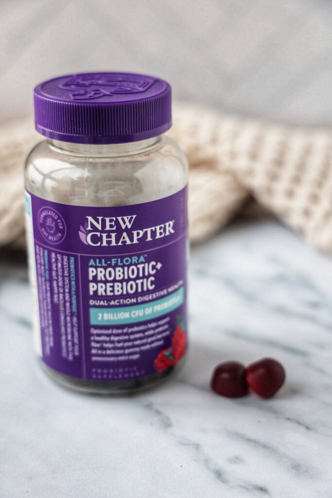 A container of new chapter all-flora probiotic + prebiotic.