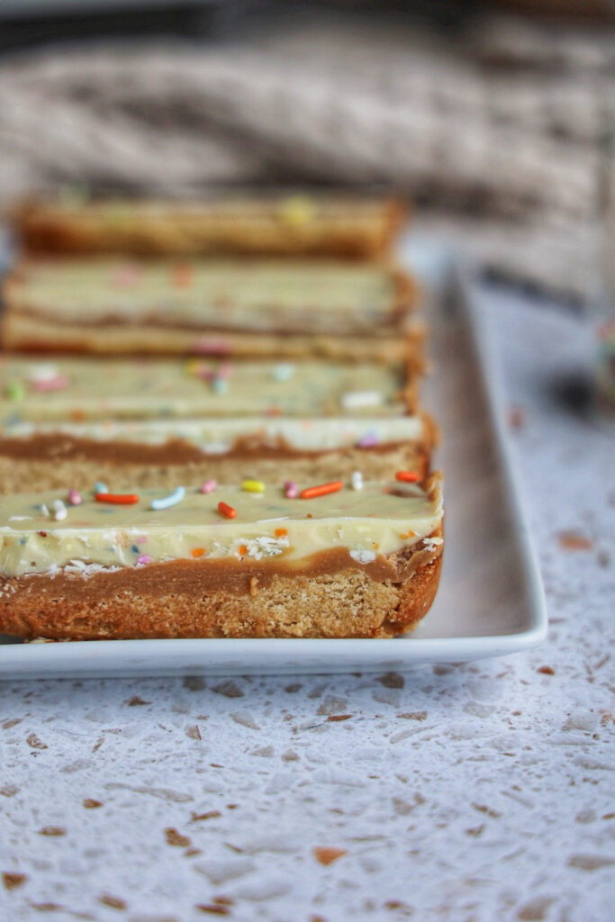 A plate of vegan birthday cake twix bars.