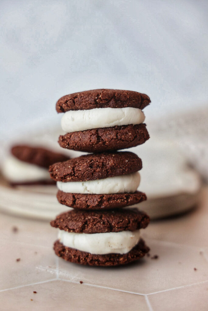 A stack of gluten free chocolate sandwich cookies.