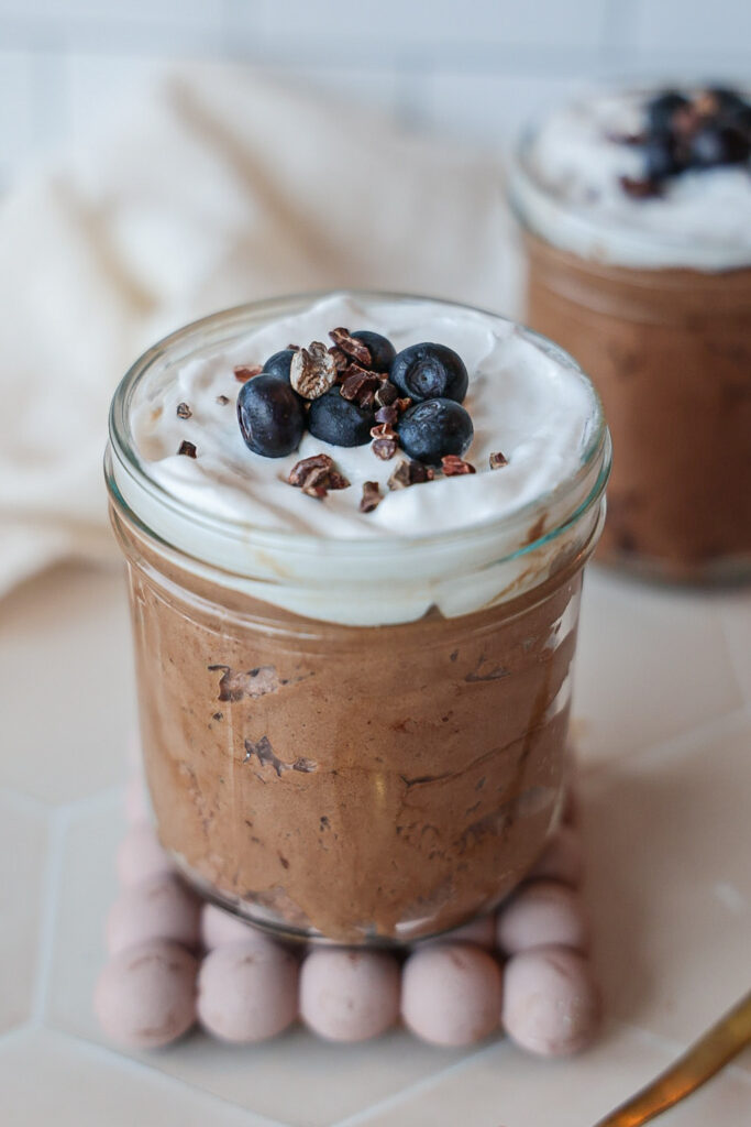 A jar of aquafaba chocolate mousse without eggs.