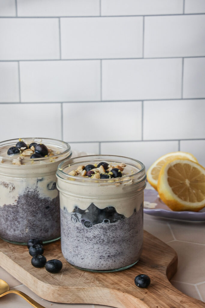 Two jars of lemon blueberry chia pudding with coconut milk.