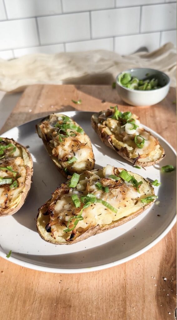 A plate of french onion twice baked potatoes.