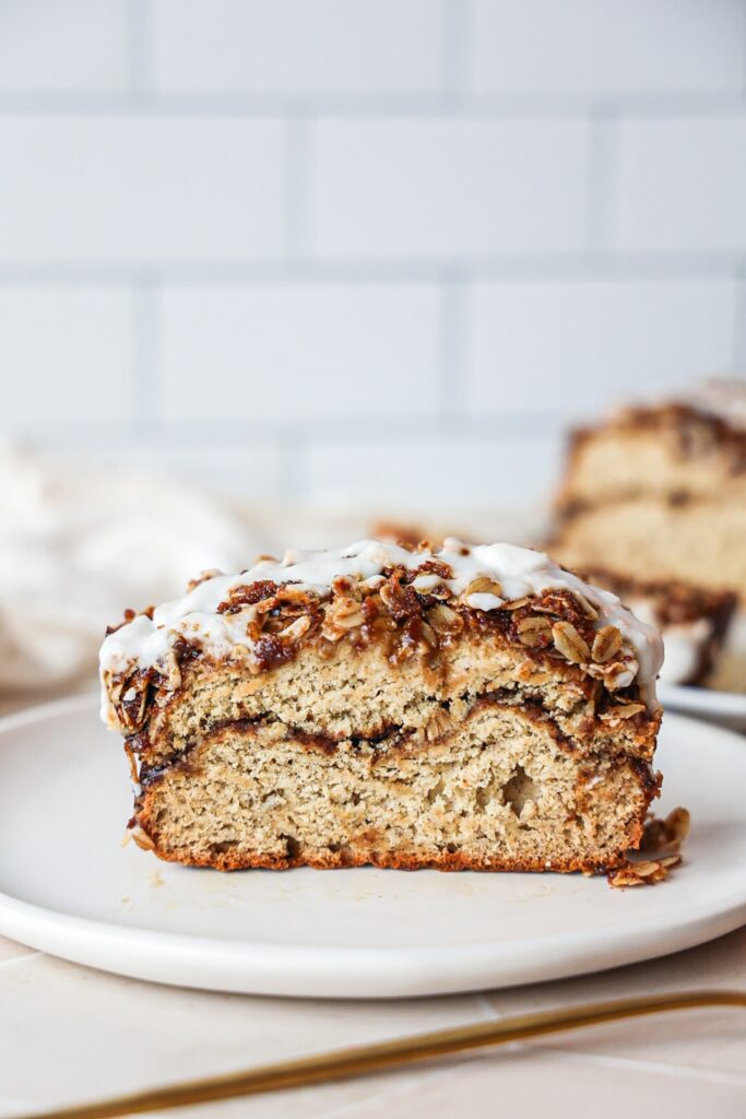 a slice of cinnamon swirl banana bread with streusel topping.