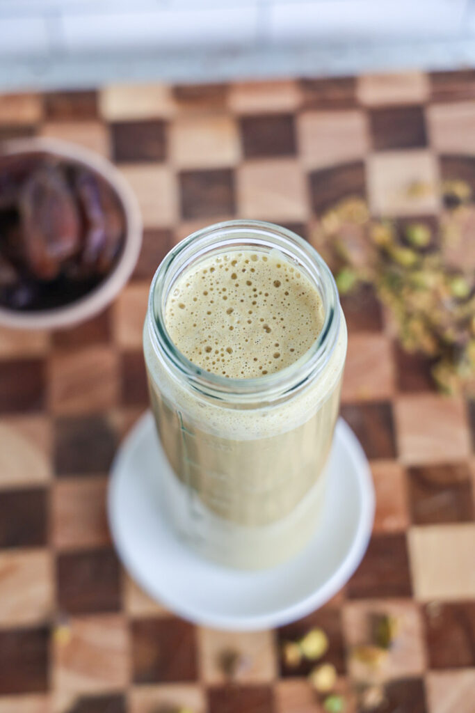 A jar of pistachio milk.